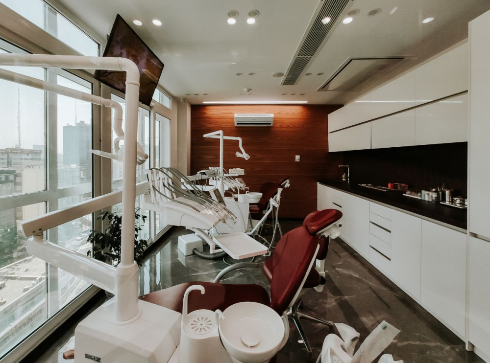 Where does a dental assistant work?