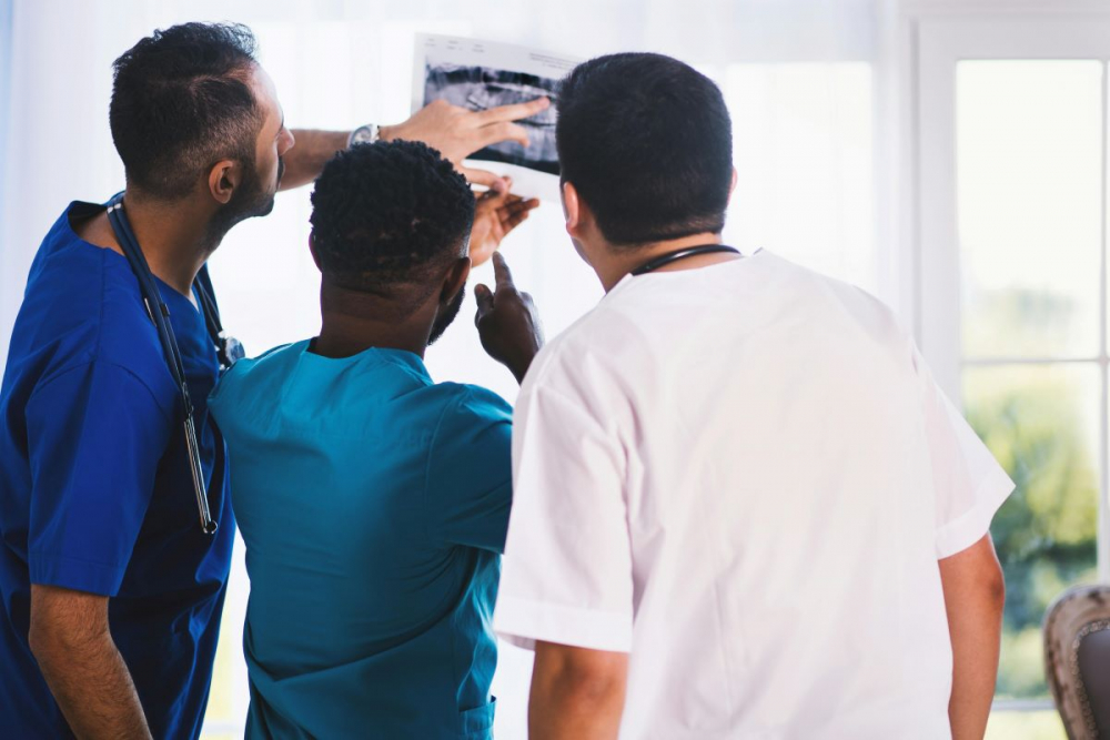 Medical assistants looking at X Ray