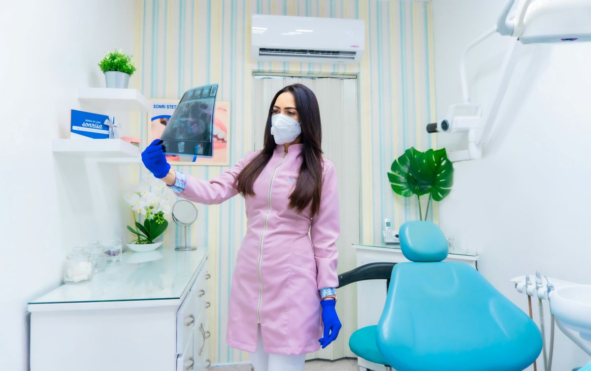 Dental assistant working in dental office
